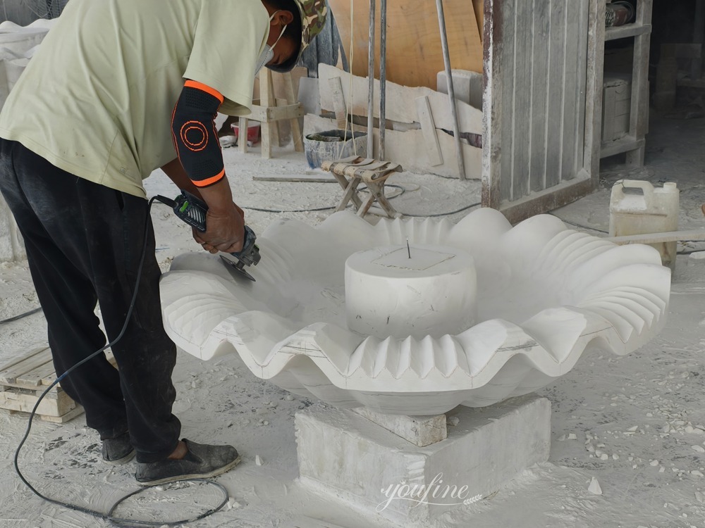 Carving process of a tiered marble fountain
